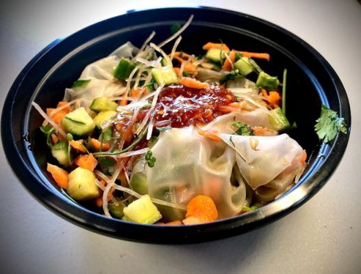 A bowl of vegetables topped with Rural Micro-Farms microgreens